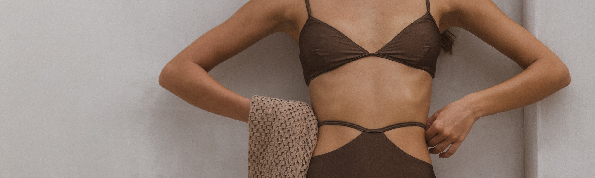 Female model wearing the Underprotection Rose Swim Triangle Top and High Waist Bikini