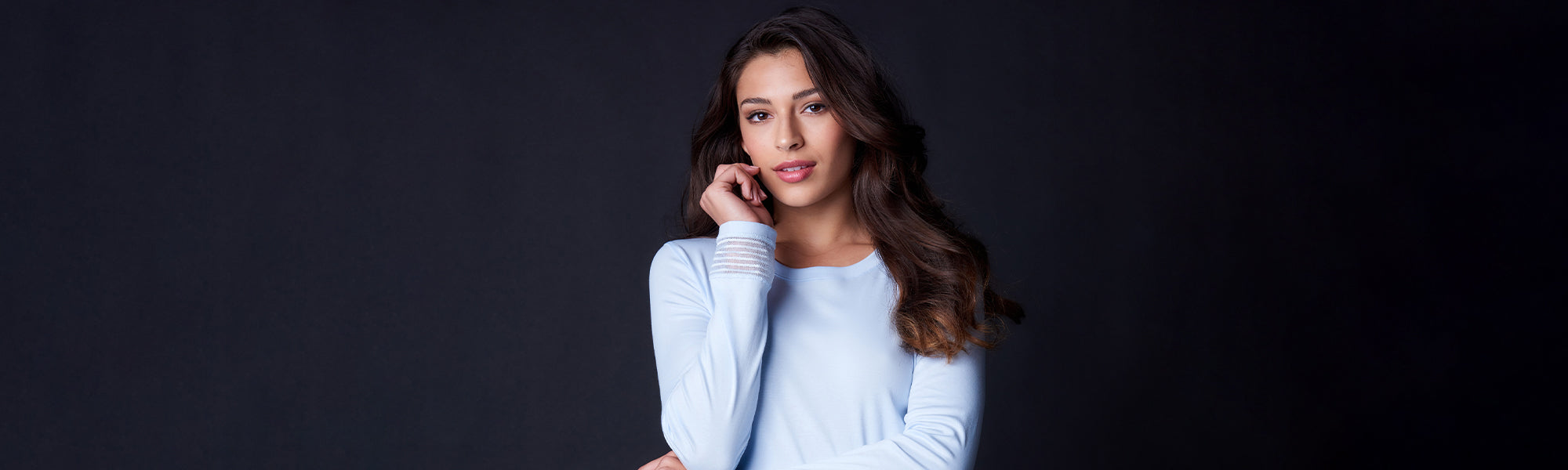 Female model wearing the Hanro Ira Long Sleeve Pajama